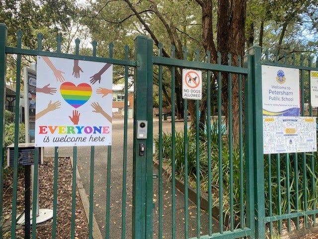 Image of school fence with Everyone is Welcome signage